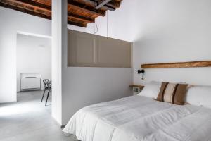 En eller flere senge i et værelse på San Michele Apartments by Wonderful Italy