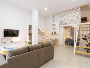 Televízia a/alebo spoločenská miestnosť v ubytovaní LU&CIA LOFT City Center