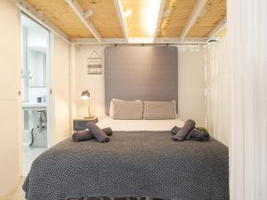 Posteľ alebo postele v izbe v ubytovaní LU&CIA LOFT City Center