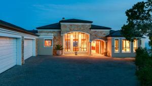a house with a driveway in front of it at Knysna, Pezula Golf Estate in Knysna