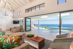 a living room with a view of the ocean at Knysna, Pezula Golf Estate in Knysna
