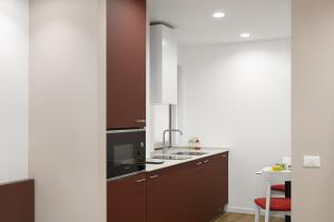 Kuchyň nebo kuchyňský kout v ubytování Apartment Ninetta Belluno Dolomiti