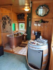 an rv bathroom with a tub and a sink at Olympic Railway Inn in Sequim
