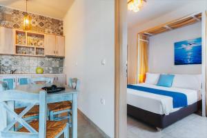 A bed or beds in a room at Aelia Apartments & Suites