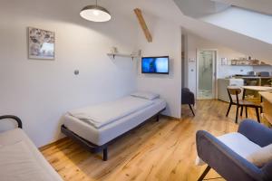 Posteľ alebo postele v izbe v ubytovaní Apartmány v domečku