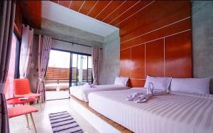 Postel nebo postele na pokoji v ubytování Virawan pool kohlarn วิราวัน พูล รีสอร์ท ที่พักเกาะล้าน
