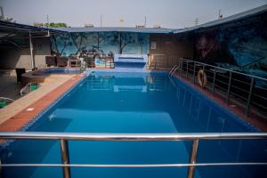 a large swimming pool on a cruise ship at Emmy Hotels & Suites in Lekki