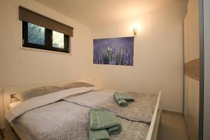 Posteľ alebo postele v izbe v ubytovaní Apartmani Nena i Branko