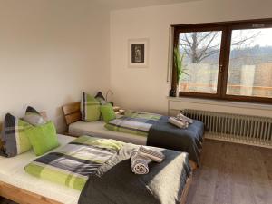 
Ein Bett oder Betten in einem Zimmer der Unterkunft Pension Am Hohberghof

