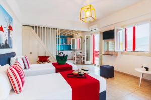 A bed or beds in a room at Aelia Apartments & Suites