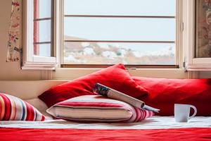 A bed or beds in a room at Aelia Apartments & Suites