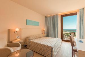 Letto o letti in una camera di Smy Carlos V Wellness & Spa Alghero