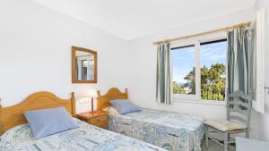 Postel nebo postele na pokoji v ubytování Can 1 - Calella de Palafrugell