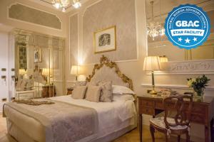 a bedroom with a bed and a sign that reads star benefit at Grand Hotel Majestic gia' Baglioni in Bologna