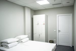 Postel nebo postele na pokoji v ubytování Hostel City Center