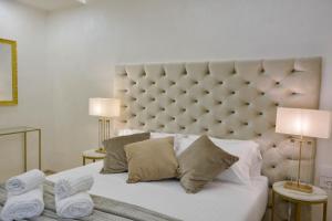 Ліжко або ліжка в номері WAMMA Luxury House with Terrace