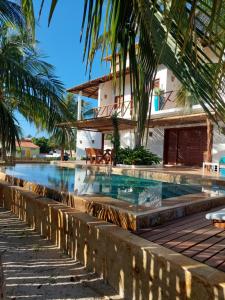 a swimming pool in front of a villa at Villa Aracoara in Prea