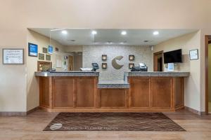 a lobby with a bar in a hospital at Comfort Inn & Suites Cedar Rapids North - Collins Road in Cedar Rapids