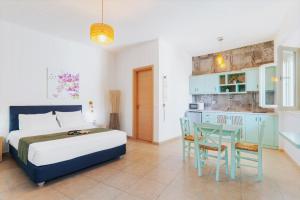 A kitchen or kitchenette at Aelia Apartments & Suites