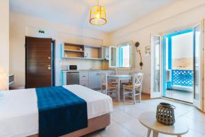 A bed or beds in a room at Aelia Apartments & Suites