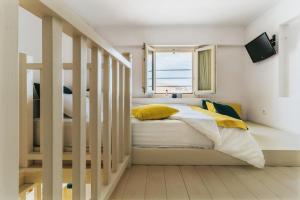 A bed or beds in a room at Aelia Apartments & Suites