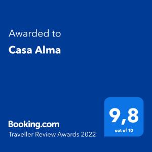 a screenshot of a cell phone with the text awarded to casa alima travelling at Casa Alma in Marbella