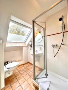 Koupelna v ubytování Gästehaus Südheide + 31 fotografií