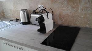 a toaster and a blender on a kitchen counter at Kira in Uzès +7 photos
