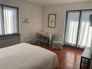 Postel nebo postele na pokoji v ubytování Albergo La Perla