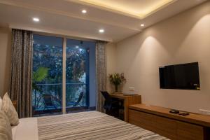 Katil atau katil-katil dalam bilik di Perch Service Apartment-MG Road