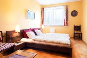 Łóżko lub łóżka w pokoju w obiekcie Trinity Apartment