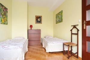 Łóżko lub łóżka w pokoju w obiekcie Trinity Apartment