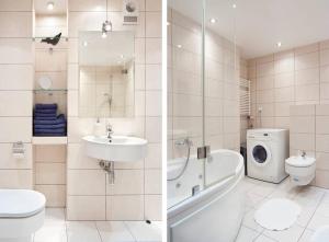 W łazience znajduje się umywalka i pralka. w obiekcie Trinity Apartment w Krakowie