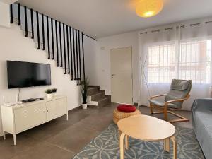 TV a/nebo společenská místnost v ubytování Casa Los Tejares Casasol