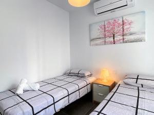 Postel nebo postele na pokoji v ubytování Casa Los Tejares Casasol