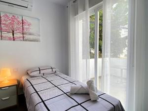 Postel nebo postele na pokoji v ubytování Casa Los Tejares Casasol