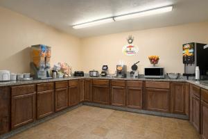 A kitchen or kitchenette at Super 8 by Wyndham Cedar Rapids