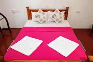 Postel nebo postele na pokoji v ubytování Suba Home Stay