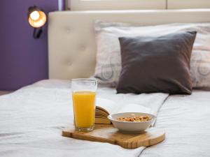 Postel nebo postele na pokoji v ubytování Apartments Aida