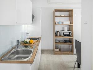 Kuchyň nebo kuchyňský kout v ubytování Apartments Aida