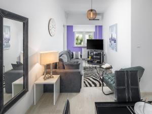 TV a/nebo společenská místnost v ubytování Apartments Aida