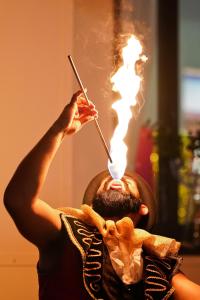 a man with a candle on his face with ahibahibahibahibahibahiba at Hotel Giulia in Lido di Camaiore