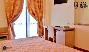 Postel nebo postele na pokoji v ubytování Hotel Nedy