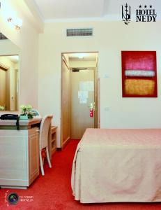 Postel nebo postele na pokoji v ubytování Hotel Nedy