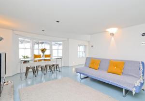 a living room with a couch and a table at Central Apartment Bedford Loft in Worthing