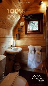 a small bathroom with a sink and a toilet at CORK VALLEY - Pet Friendly & Only Adults in Hontanar
