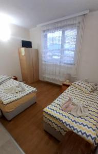 Postel nebo postele na pokoji v ubytování Guesthouse Pumpalovi