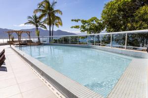 a large swimming pool on top of a building at Hotel Mercedes in Ilhabela