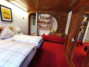 Ένα ή περισσότερα κρεβάτια σε δωμάτιο στο Au repos des remparts