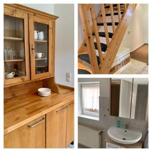 a bathroom with a wooden cabinet and a sink at Ferienhaus LiebensWert an der St Stephan Kirche Tangermünde in Tangermünde